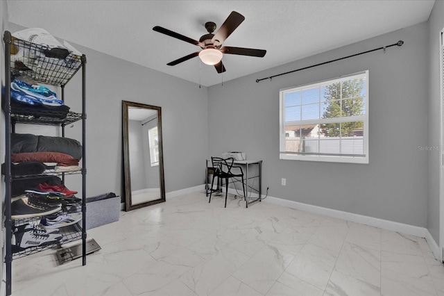 interior space featuring ceiling fan