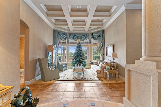 interior space featuring ornate columns, a high ceiling, coffered ceiling, beamed ceiling, and crown molding