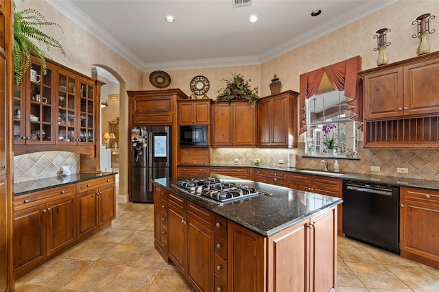 kitchen featuring backsplash, black appliances, and ornamental molding