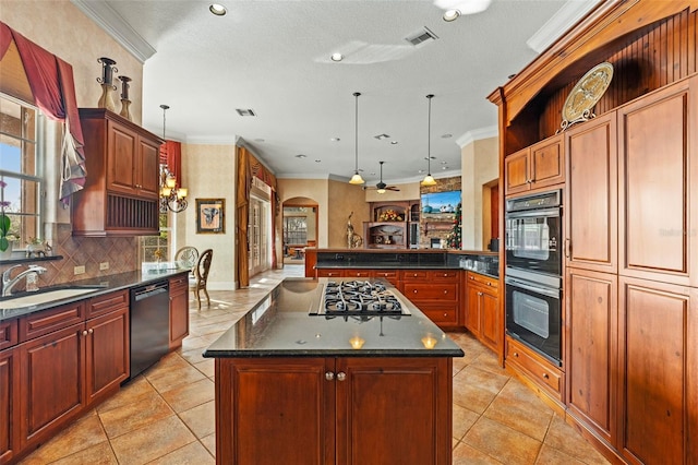 kitchen featuring sink, a kitchen island, crown molding, and black appliances