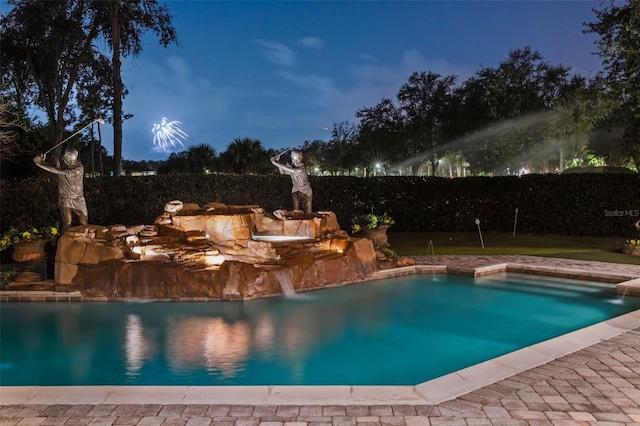 view of swimming pool featuring pool water feature