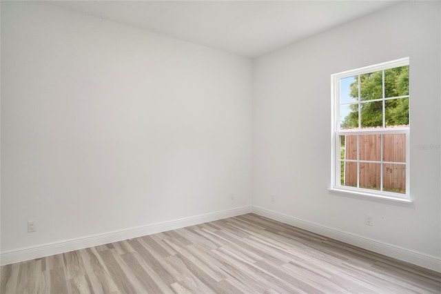 unfurnished room featuring light wood-type flooring