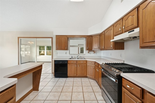 kitchen with gas range, dishwasher, light tile patterned floors, and sink