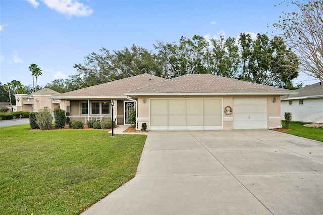 single story home featuring a garage and a front lawn