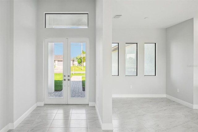 tiled entryway with french doors