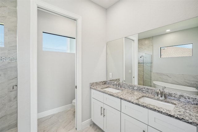 full bathroom with vanity, a wealth of natural light, and plus walk in shower