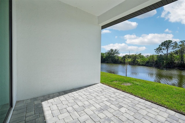 view of patio featuring a water view