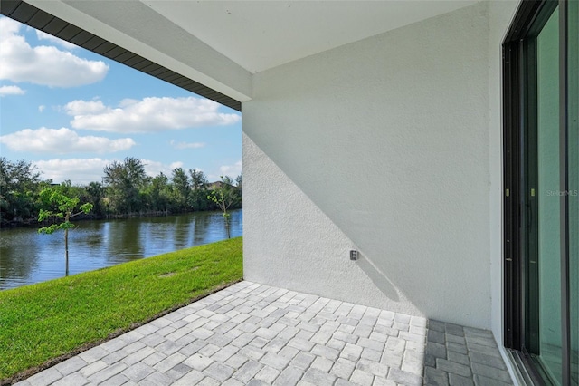 view of patio featuring a water view