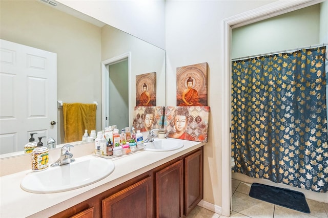 bathroom with vanity and tile patterned flooring