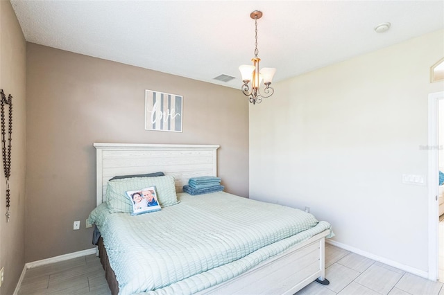 bedroom with an inviting chandelier