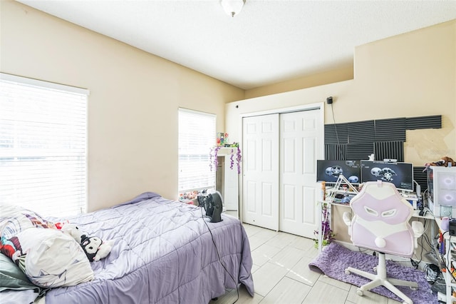 bedroom featuring a closet and a textured ceiling