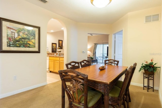 view of carpeted dining area