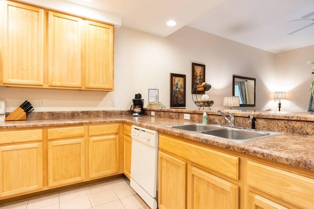 kitchen featuring white dishwasher, sink, light tile patterned floors, ceiling fan, and light brown cabinets