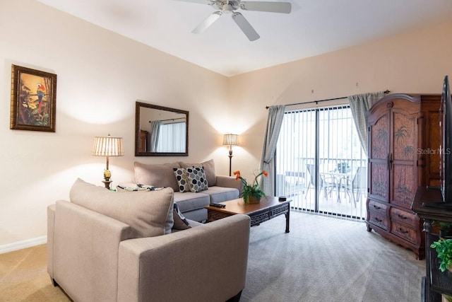 living room featuring light carpet and ceiling fan