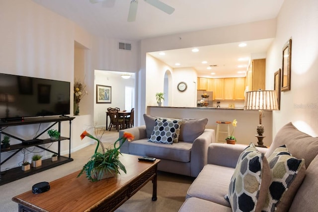 living room featuring ceiling fan and carpet floors