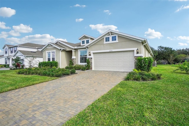 view of front of property with a garage and a front yard