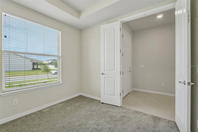 unfurnished bedroom featuring light colored carpet