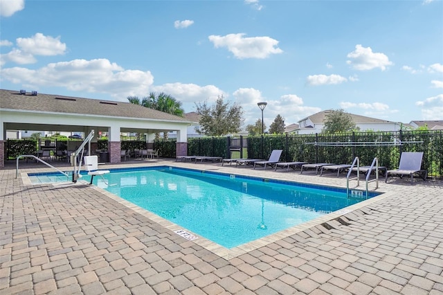 view of swimming pool with a patio