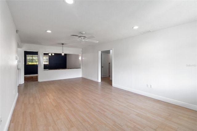 unfurnished living room featuring light wood-type flooring and ceiling fan