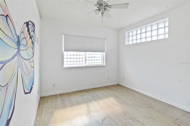 spare room with ceiling fan and light hardwood / wood-style floors