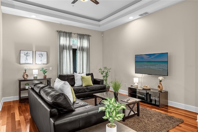 living room with hardwood / wood-style flooring and ceiling fan