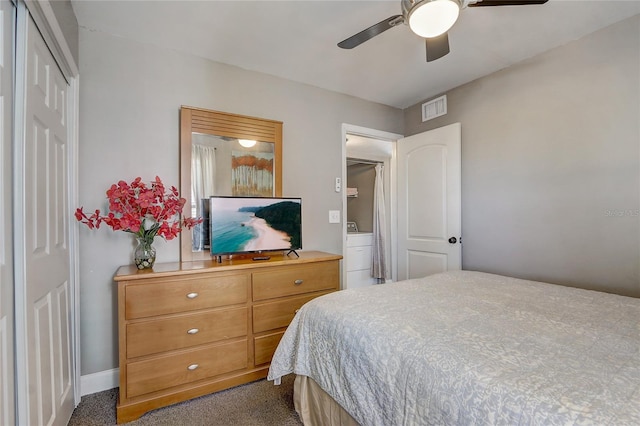 bedroom featuring a closet, dark carpet, and ceiling fan