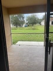 doorway with concrete floors