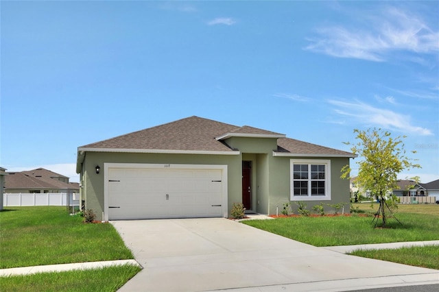 view of front facade with a garage and a front lawn