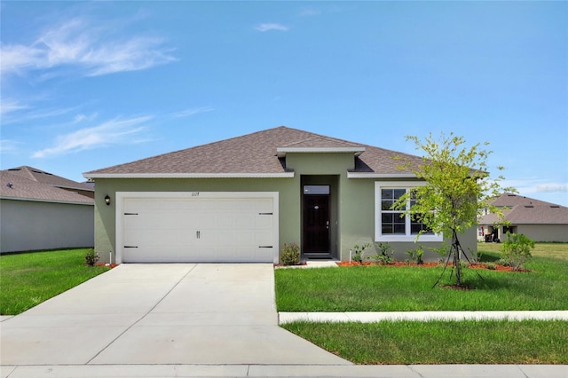 view of front of home featuring a garage and a front lawn