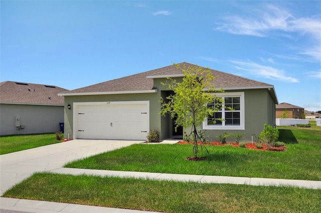 ranch-style home with a garage and a front yard