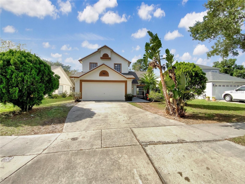 view of front facade with a garage and a front yard