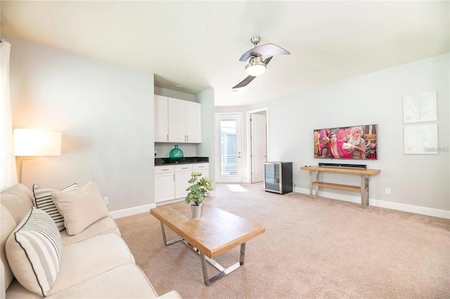 carpeted living room featuring ceiling fan