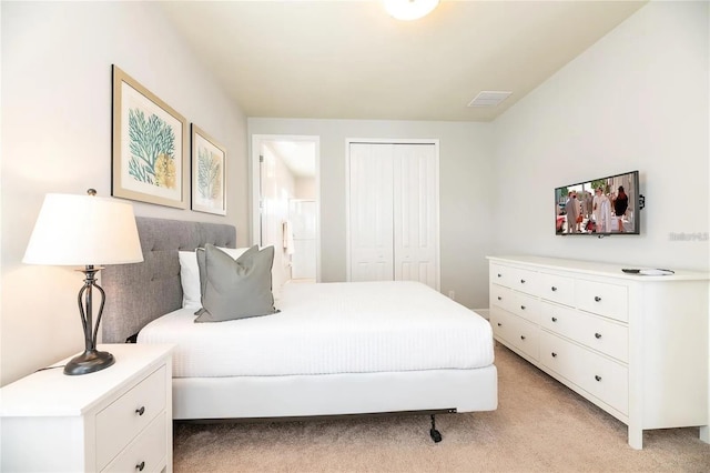 carpeted bedroom with a closet