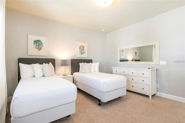 bedroom with light colored carpet