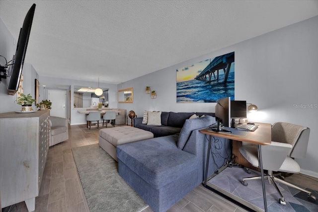 living room featuring a textured ceiling