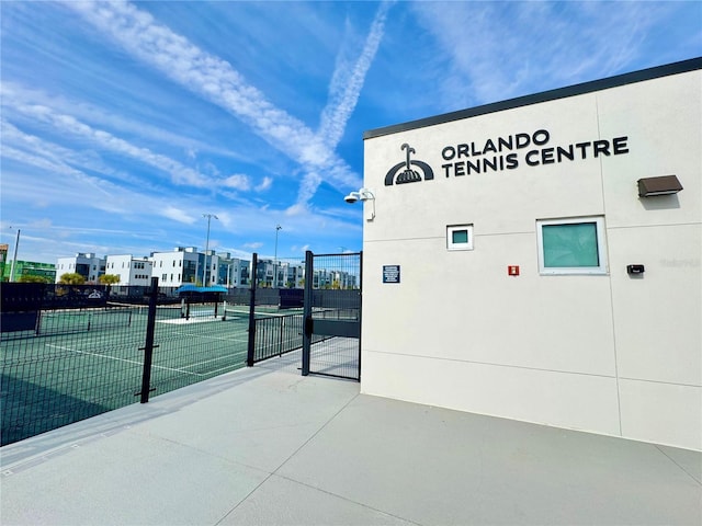 surrounding community with tennis court