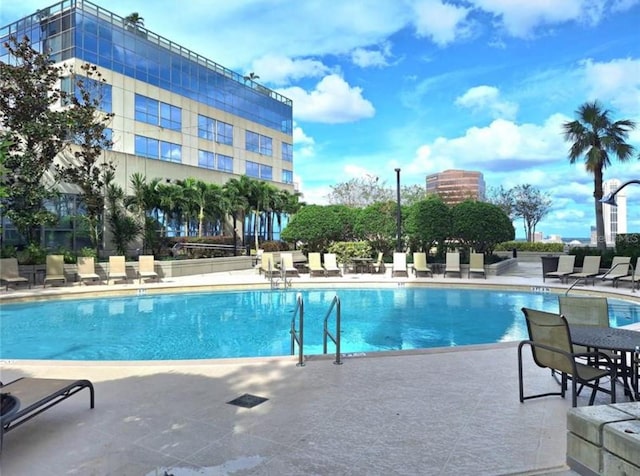 view of swimming pool featuring a patio area