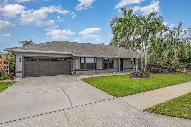 ranch-style home with a garage and a front yard