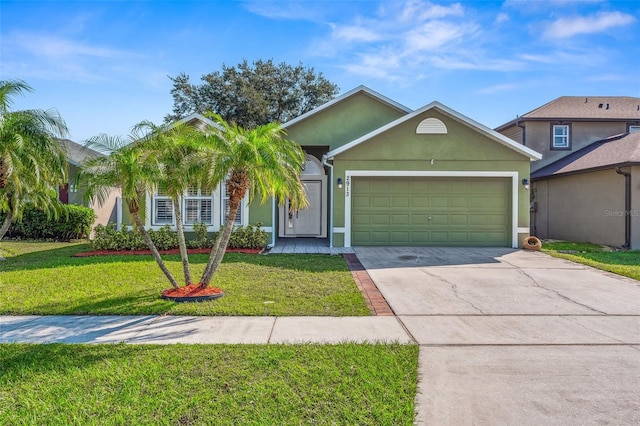 view of front of house with a garage and a front lawn