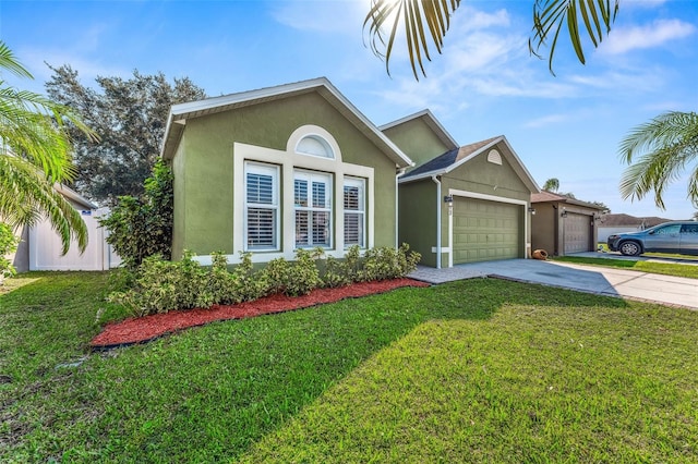 ranch-style home with a front yard and a garage