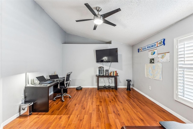 office with a textured ceiling, hardwood / wood-style flooring, ceiling fan, and lofted ceiling