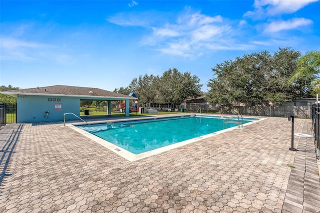 view of swimming pool with a patio