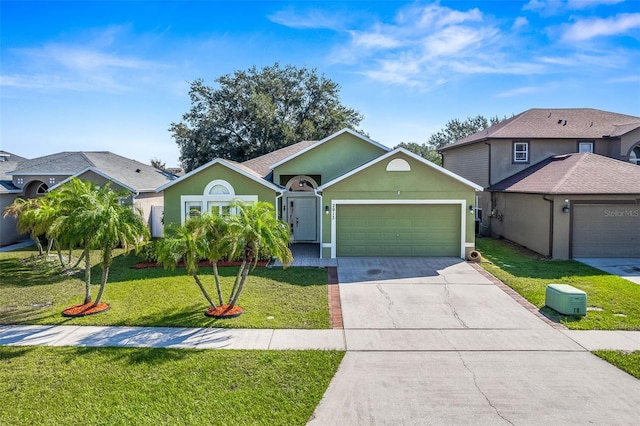 view of front of property with a front yard and a garage