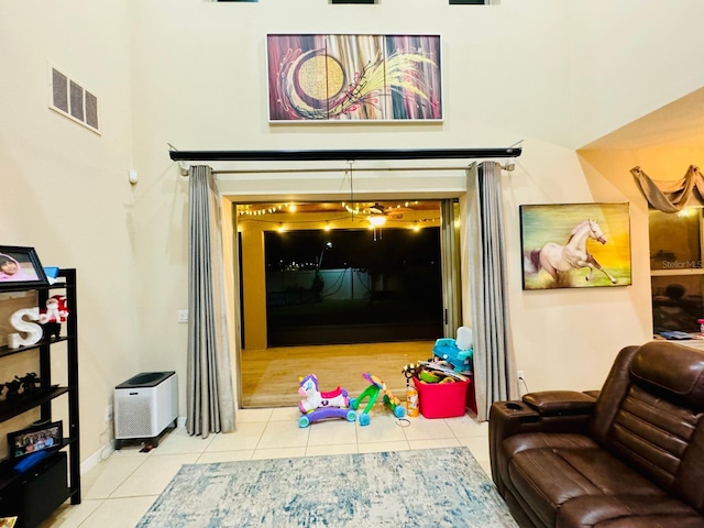 game room with light tile patterned flooring