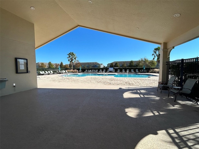 pool with a patio area