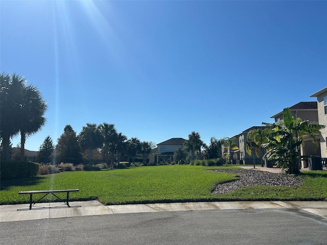 view of community with a lawn and a residential view