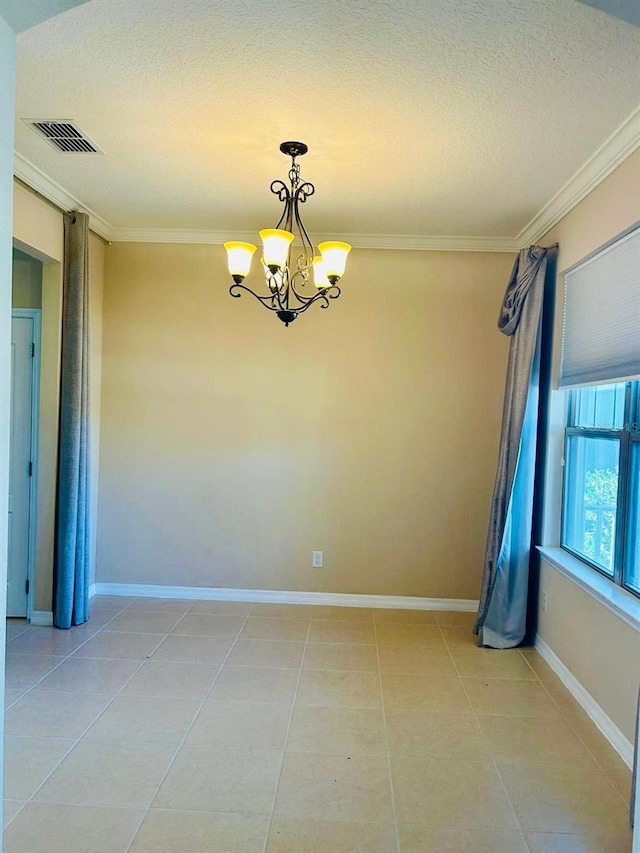 unfurnished room featuring visible vents, an inviting chandelier, ornamental molding, and light tile patterned flooring