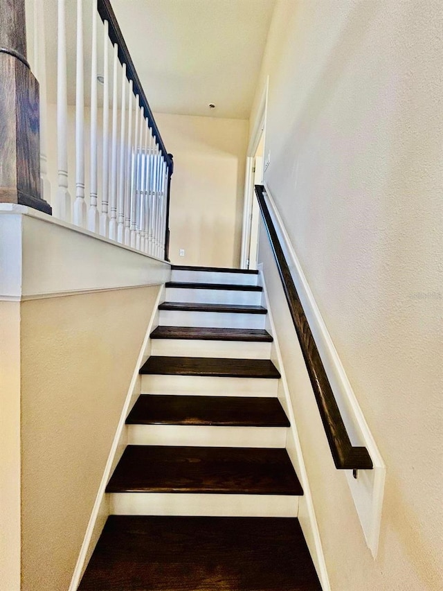 stairs featuring baseboards