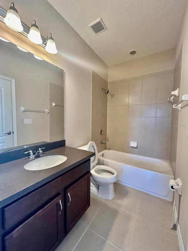 full bath featuring visible vents, a textured ceiling, tile patterned flooring, bathtub / shower combination, and vanity