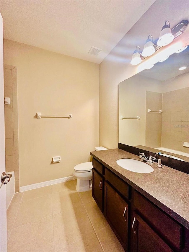 full bath featuring vanity, visible vents, baseboards, tile patterned flooring, and toilet